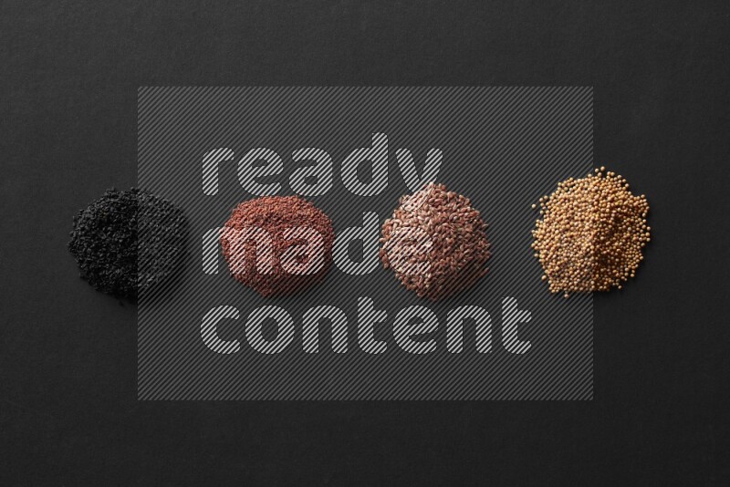 حبة البركة و حبوب الخردل وحبوب الكتان وحب الرشاد علي خلفية سوداء