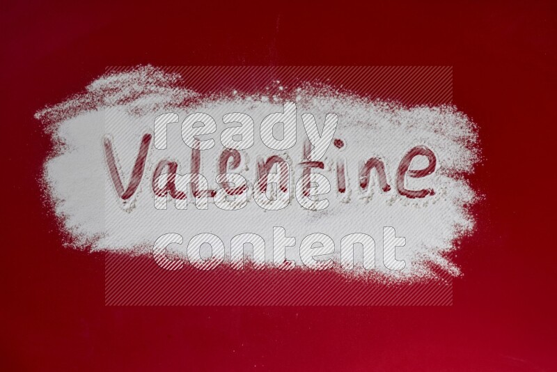 A word written with powder on red background