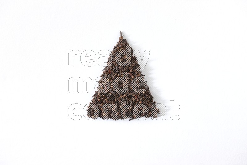 cloves in a triangle shape on a white flooring