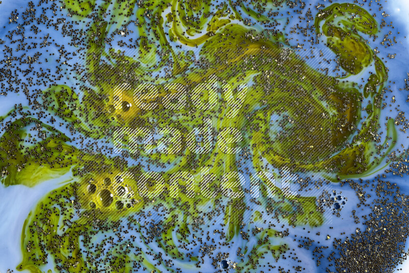 لقطة مقربة لبريق ذهبي متلألئ منتشر على خلفية من اللون الأزرق والأخضر في حركات دائرية