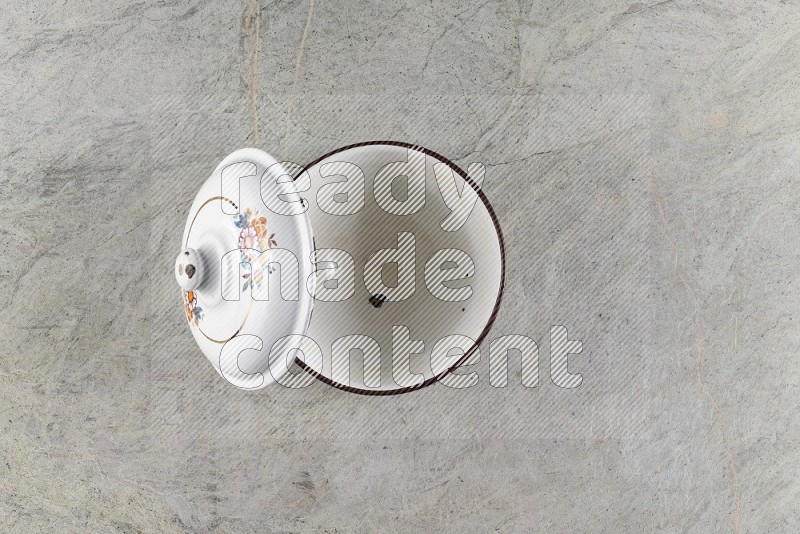 Top View Shot Of A Vintage Pot On Grey Marble Flooring