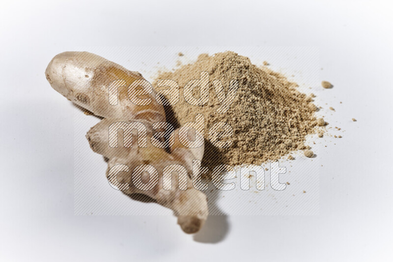 A bunch of ground ginger powder on white background