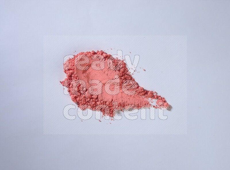 Red powder strokes on white background