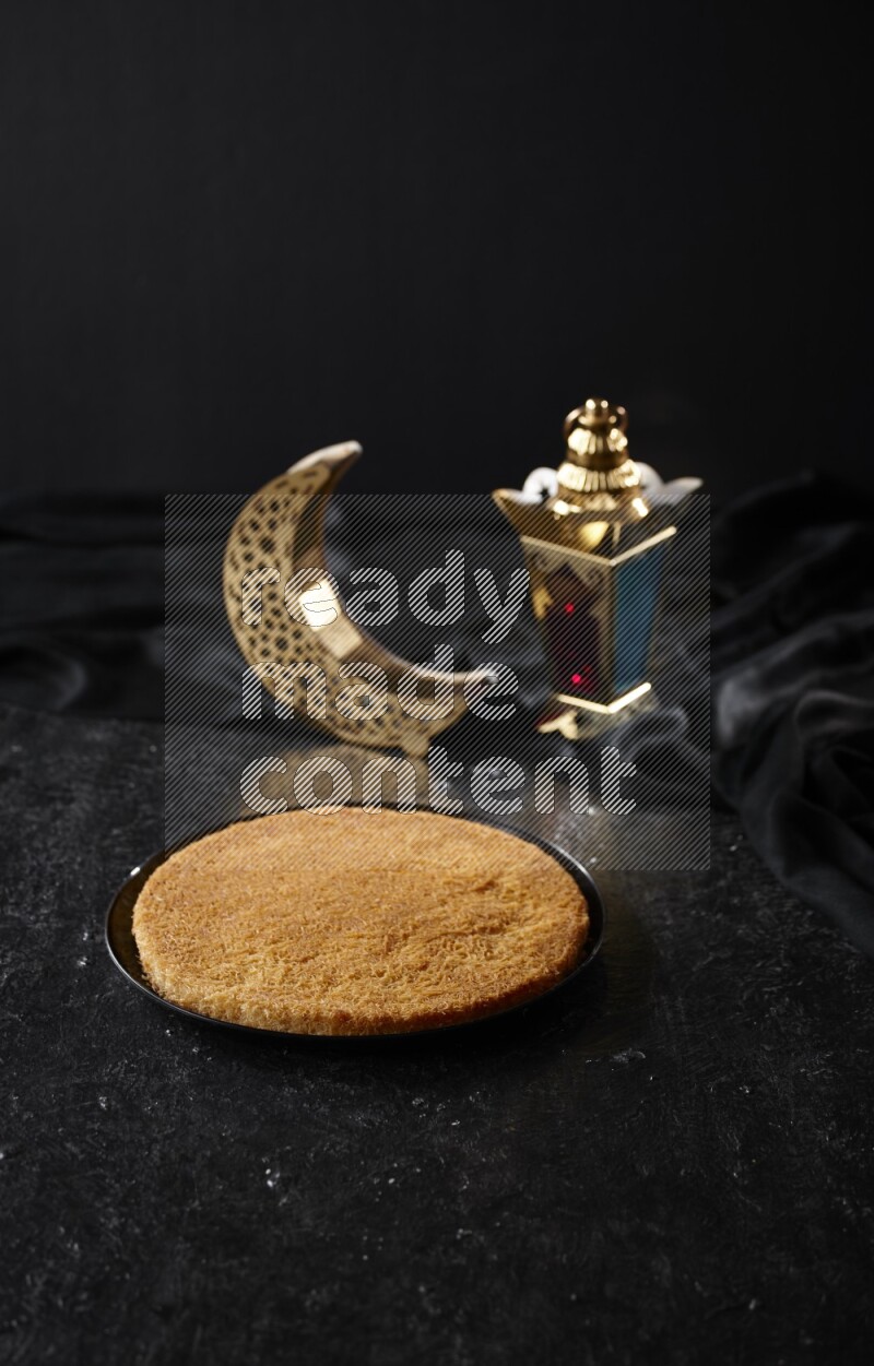Konafa with lanterns in a dark setup