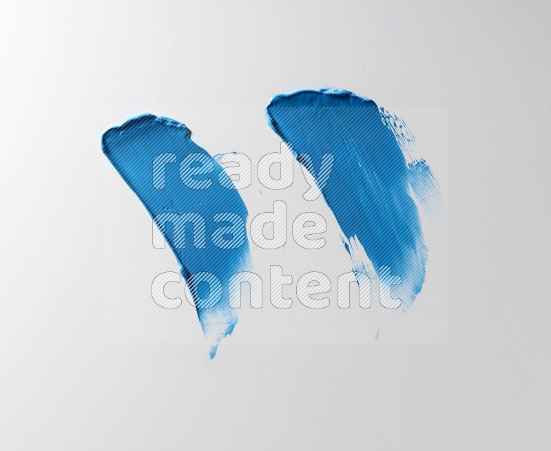 Blue painting knife strokes on white background