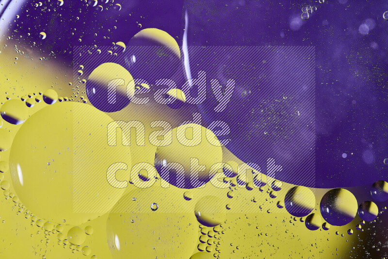 Close-ups of abstract oil bubbles on water surface in shades of purple and yellow