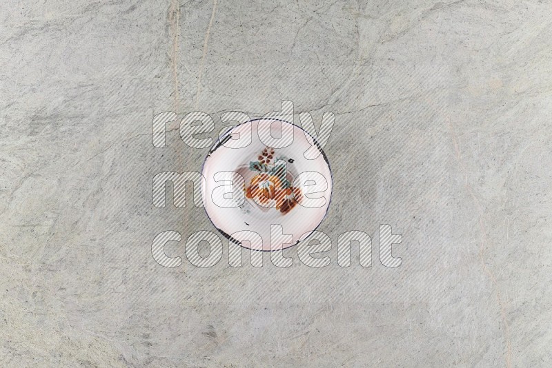 Top View Shot Of A Vintage Metal Plate On Grey Marble Flooring