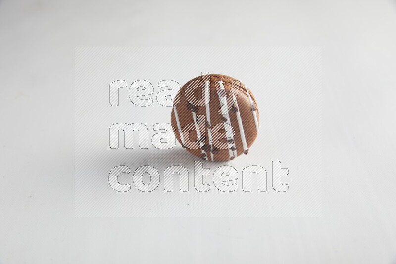 45º Shot of Brown white Chocolate Caramel macaron on white background