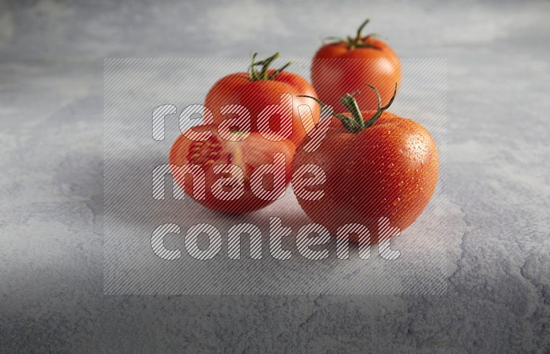 45 degree roma tomato on a textured light blue background