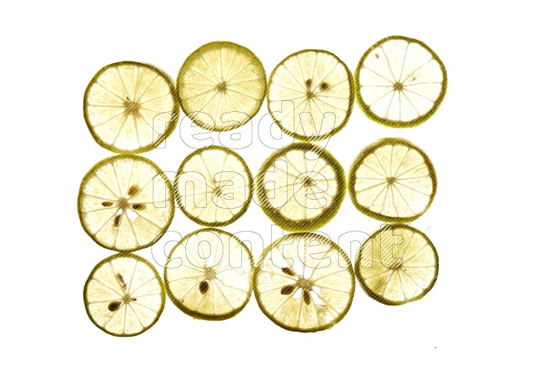 Lemon slices on illuminated white background