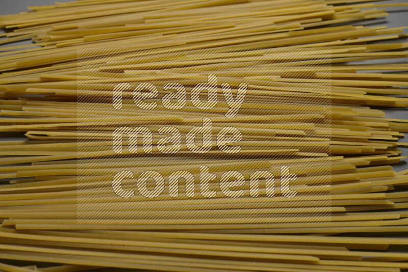 Linguini pasta on grey background