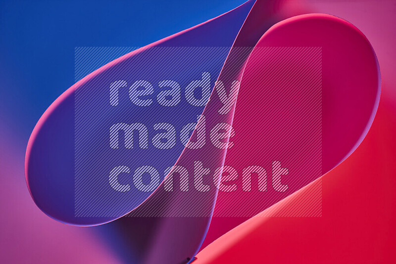 An abstract art of paper folded into smooth curves in blue, purple and red gradients