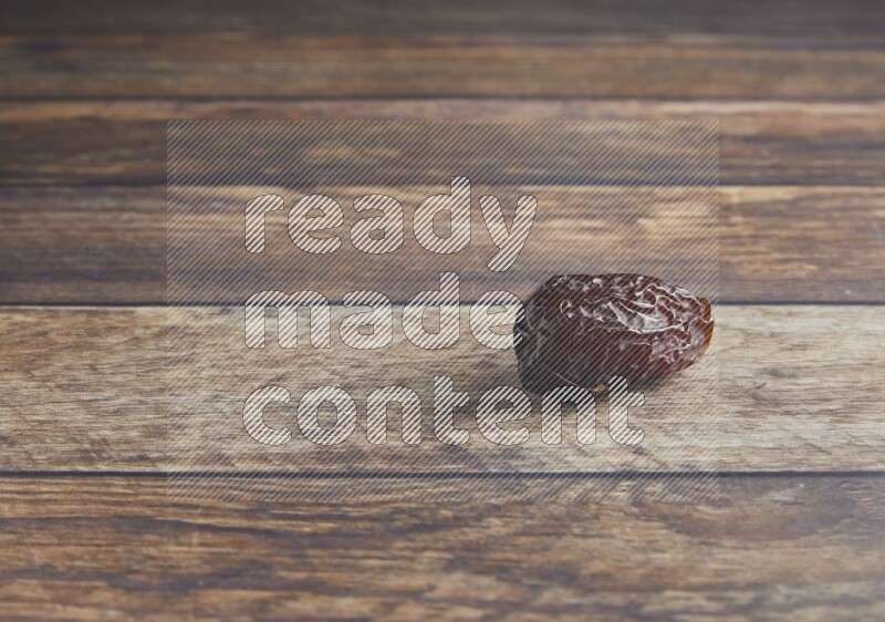 one madjoul date on a wooden background