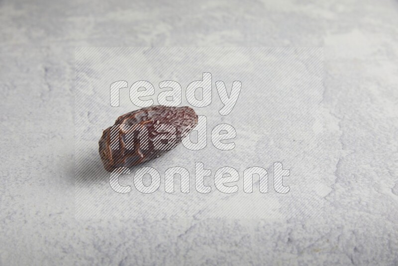 one madjoul date on a light grey background