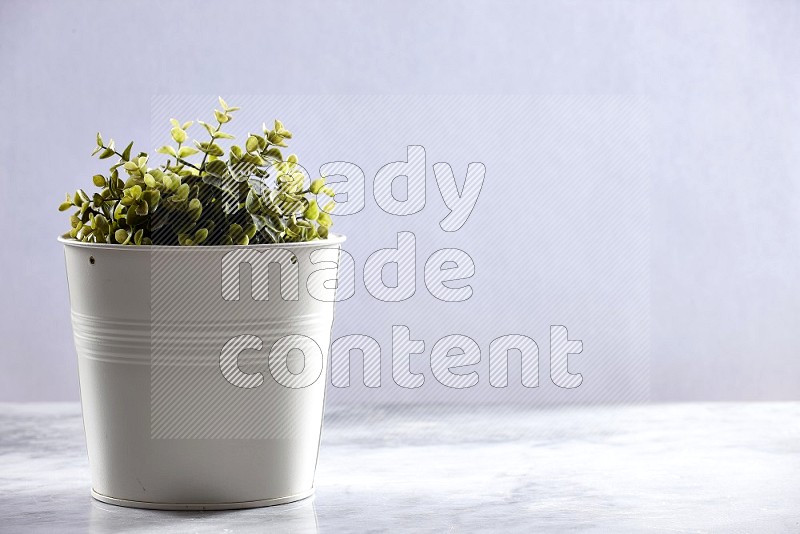 Artificial Plant in White pot on Light Grey Marble Flooring 15 degree angle