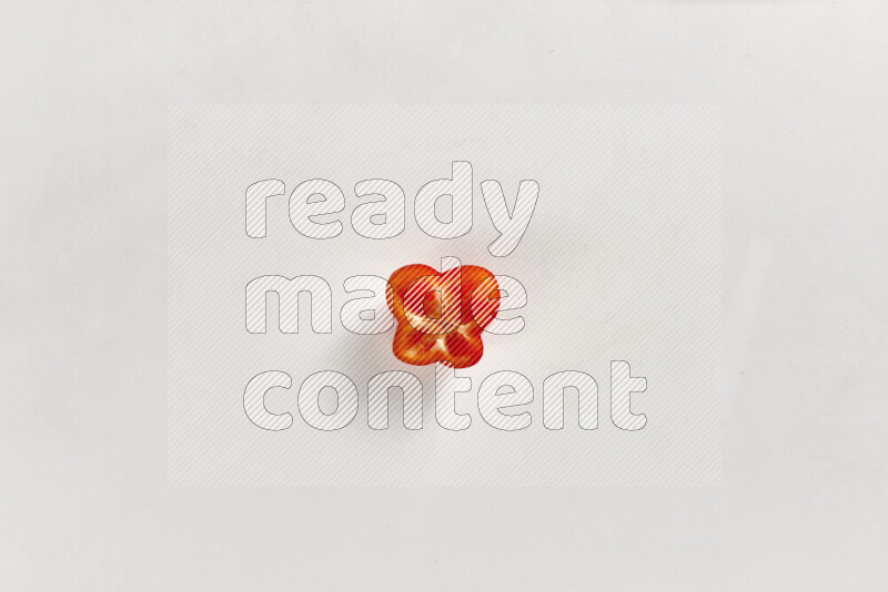 Red bell pepper slices on white background