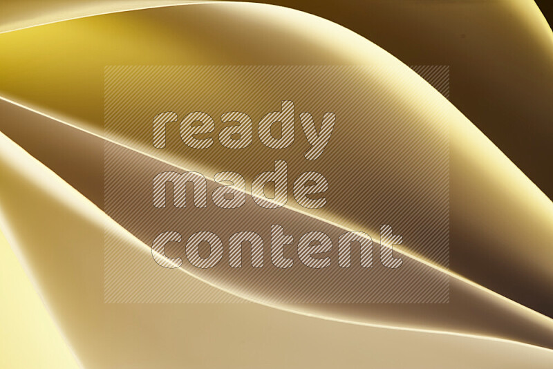 This image showcases an abstract paper art composition with paper curves in gold gradients created by colored light