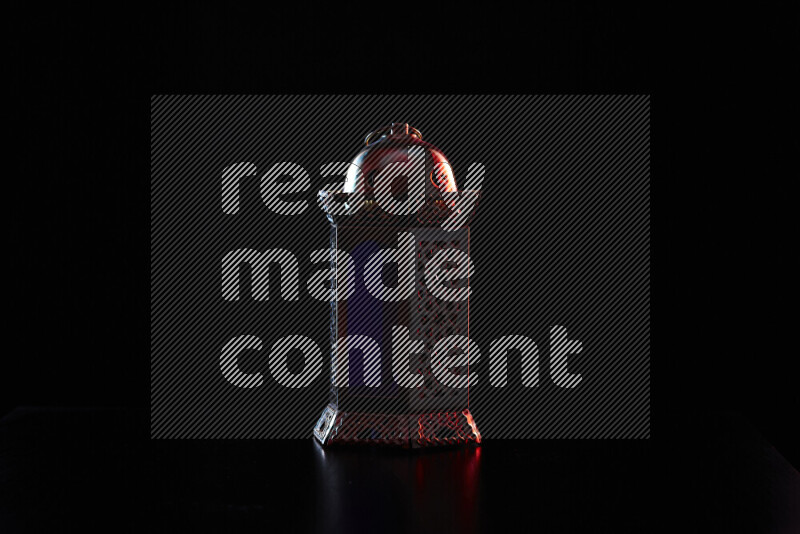 Ramadan lanterns with colored rim light against black background