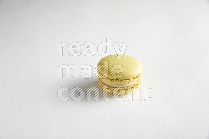 45º Shot of Yellow Lime macaron on white background
