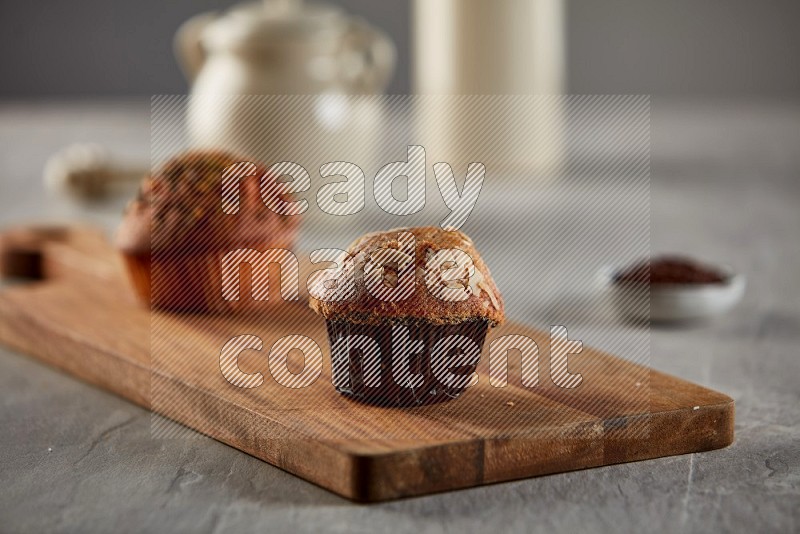 Peanut cupcake on a wooden board