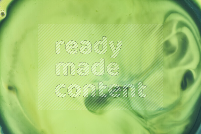 A close-up of abstract swirling patterns in green gradients