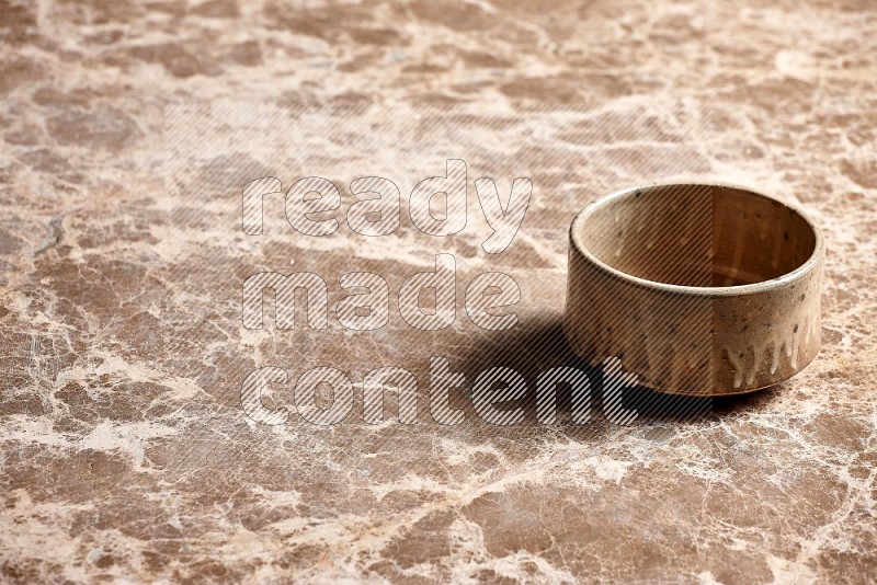 Beige Pottery Oven Bowl on Beige Marble Flooring, 45 degrees