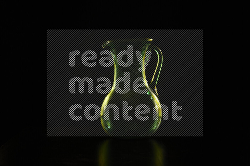 Glassware with rim light in yellow against black background