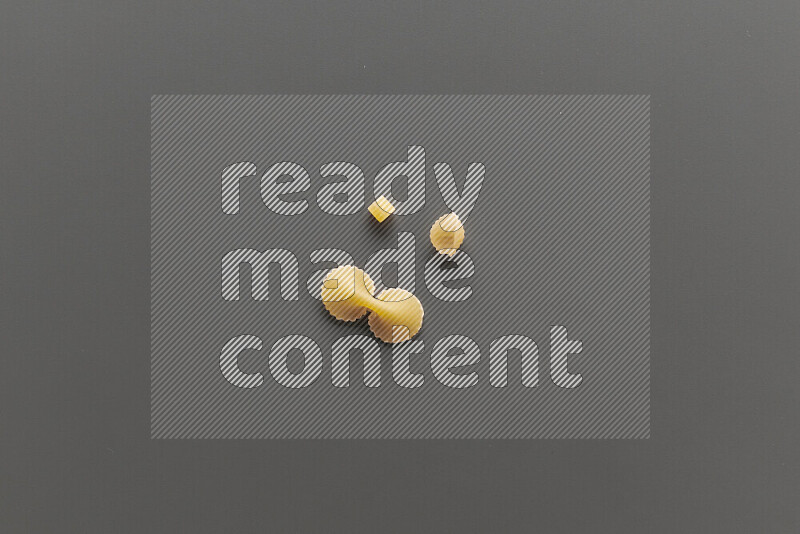 Different pasta types on grey background