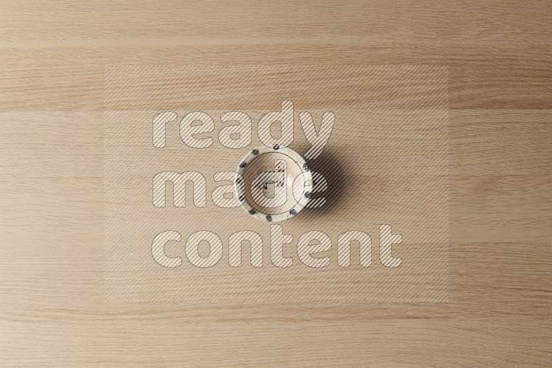Top View Shot Of A Decorative Pottery bowl on Oak Wooden Flooring