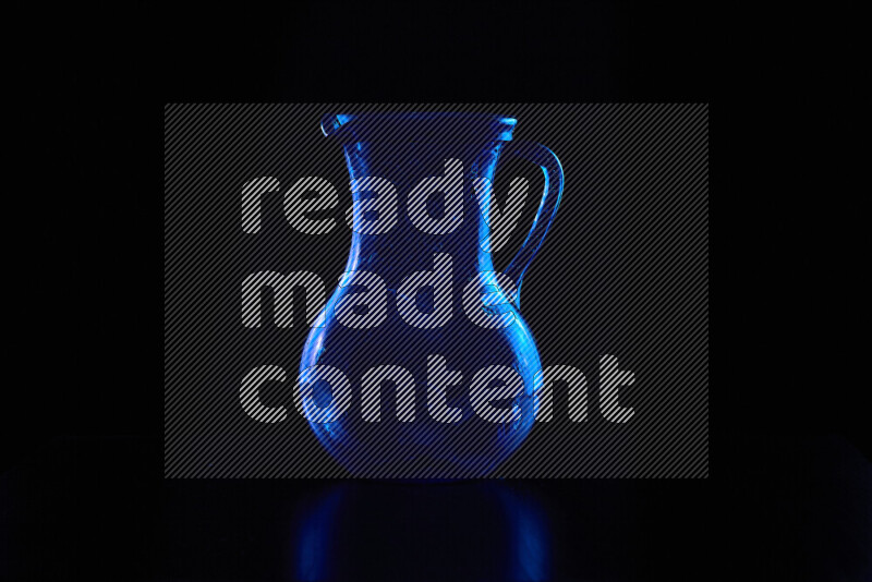 Glassware with rim light in blue against black background