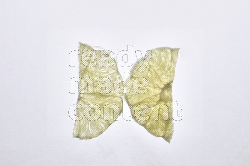 Orange slices on illuminated white background