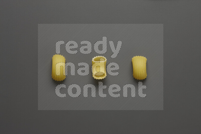 Elbow pasta on grey background