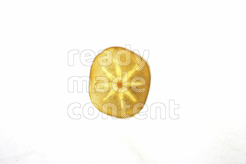Persimmon slices on illuminated white background