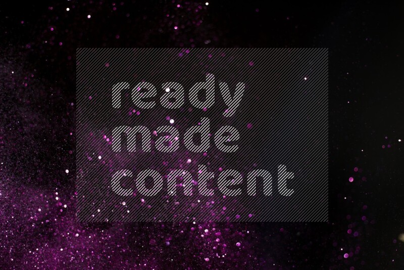 Pink glitter powder isolated on black background