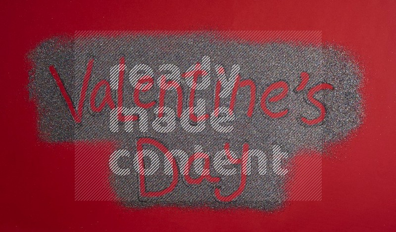 A sentence written with glitter on red background