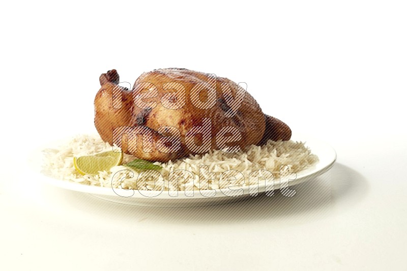 white  basmati Rice with  whole roasted chicken  on a white rounded plate direct on white background