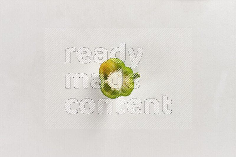 Green bell pepper slices on white background