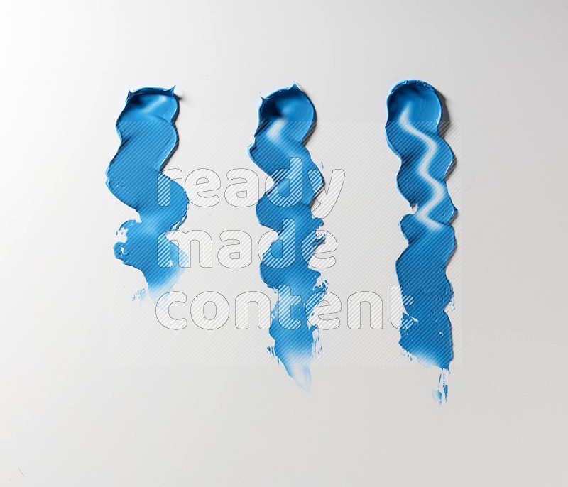 Blue zigzag painting knife strokes on white background