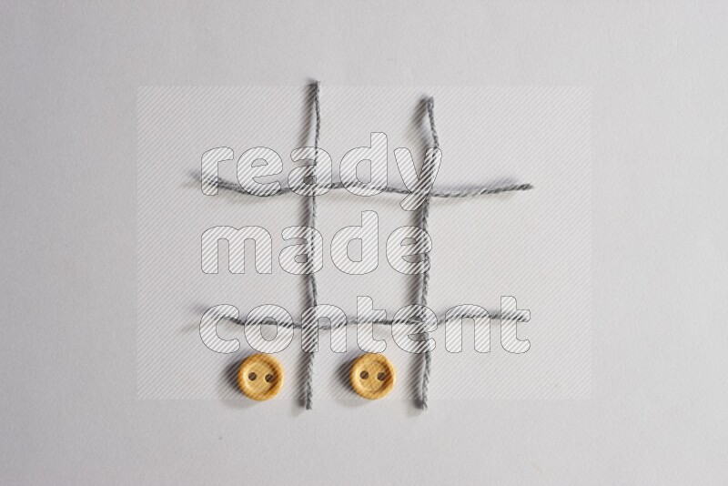 Wooden buttons placed on grey background