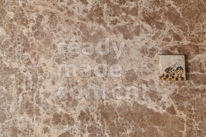 A decorative coaster on beige marble background