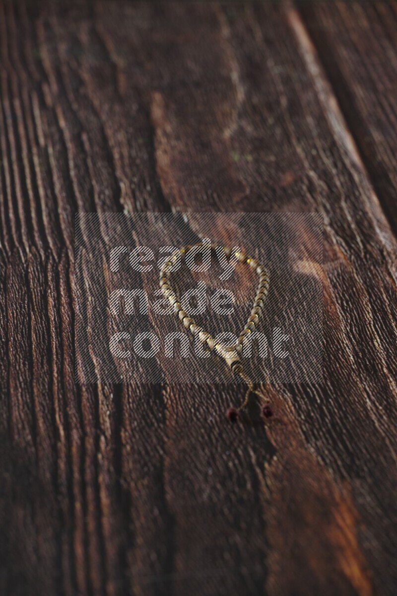 A prayer beads placed on wooden background