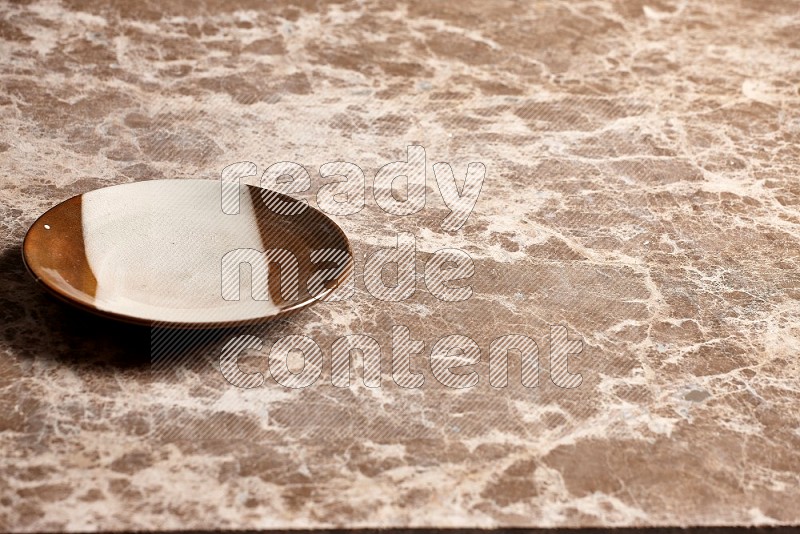 Multicolored Pottery Plate on Beige Marble Flooring, 45 degrees