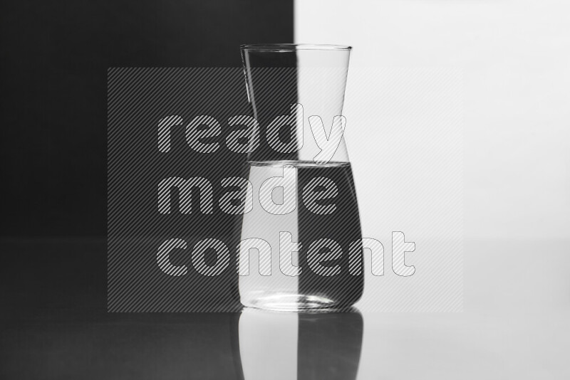 The image features a clear glassware filled with water, set against white and black background