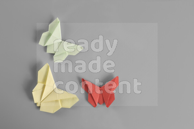 Origami butterfly on grey background