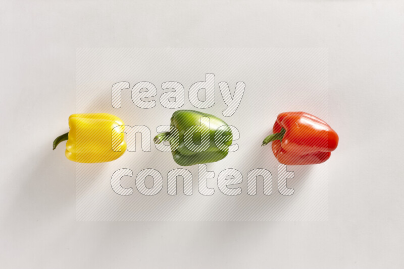 Assorted bell peppers on white background