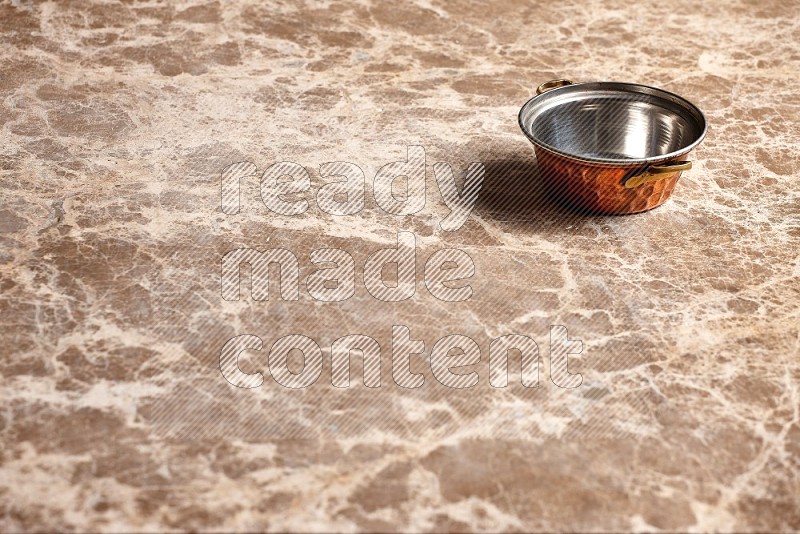 Small Copper Pot on Beige Marble Flooring, 45 degrees