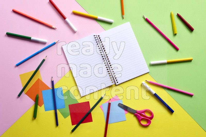 Different school supplies on multicolored backgrounds (back to school)