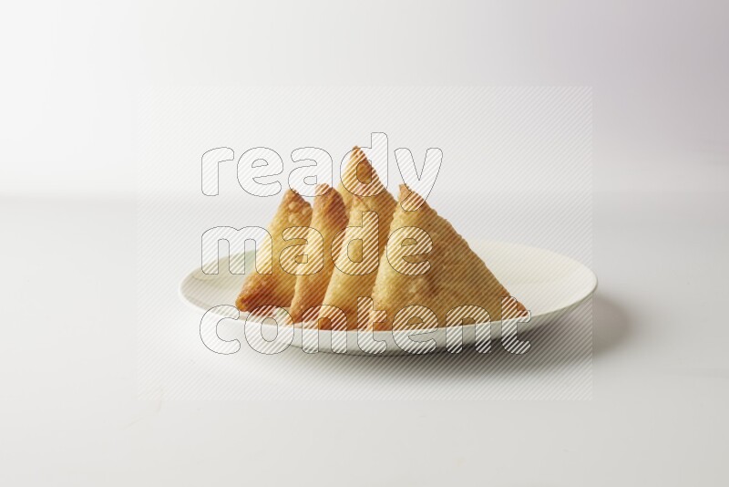 sambosas on a white background