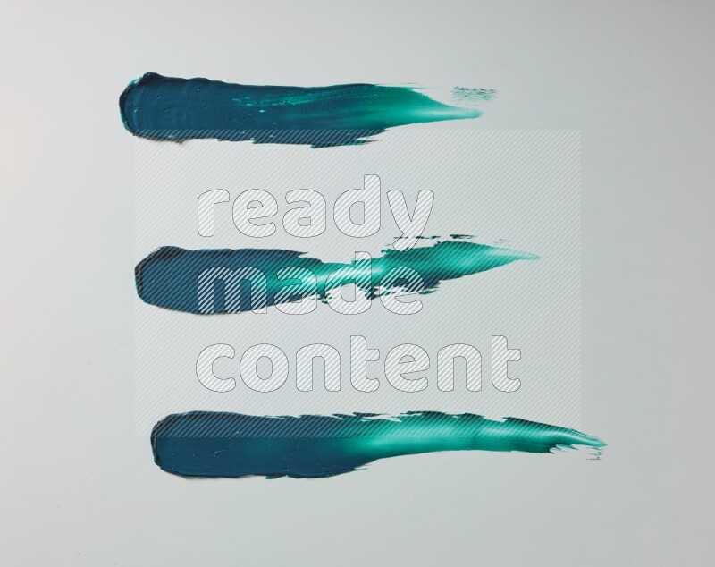 Turquoise painting knife strokes on white background