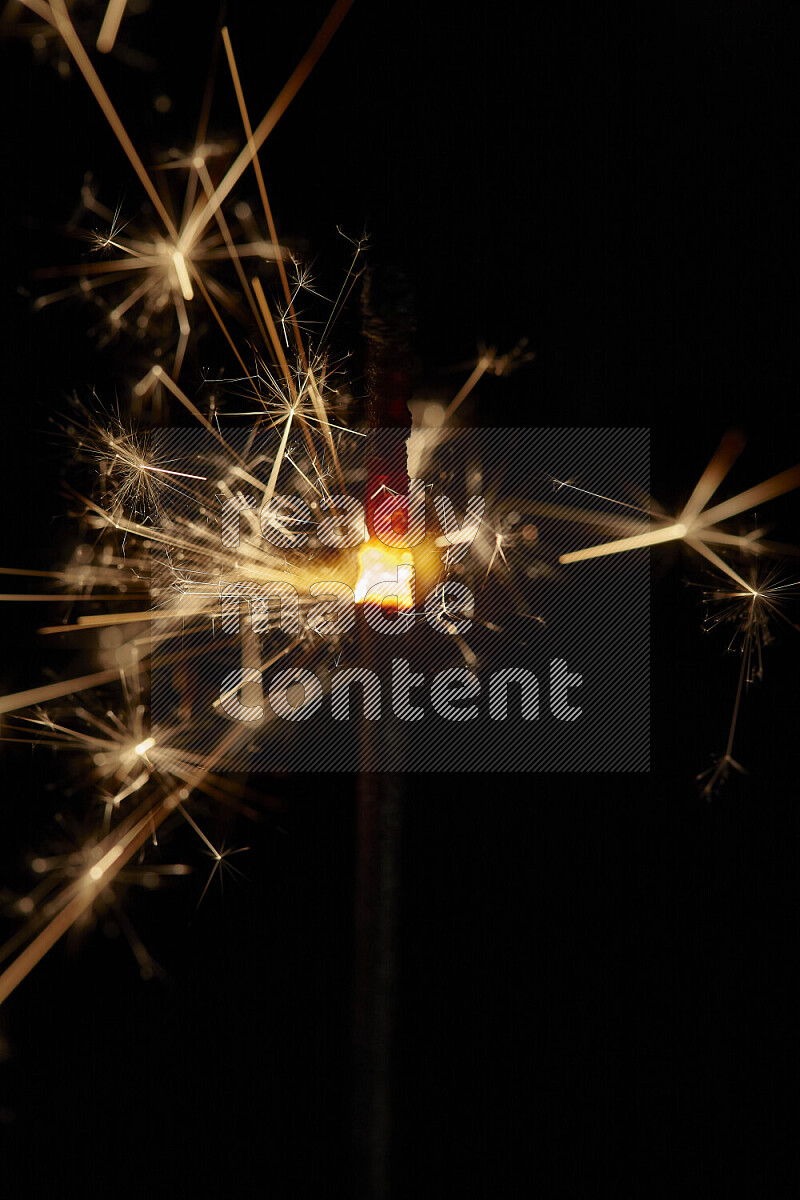 A close-up image of sparkler candle isolated on black background